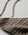 DOINDULGE Draped Asymmetric Wide-Leg Trousers in Textured Stripe