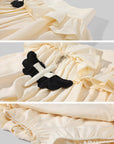 Rase le sol Cream Layered Ruffle Bubble Mini Skirt With Cross-Wing Appliqué
