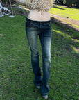 Rase le sol Faded Flared Denim Pants with Copper-Tone Rivets & Embroidered Back Pockets
