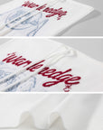 WARDEN EDGE Graphic Embroidered Strapless Knit Top with Sculpted Corset Silhouette