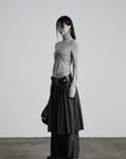 DOINDULGE Draped Twist Knit Top with High Neck and Long Sleeves