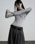 DOINDULGE Draped Twist Knit Top with High Neck and Long Sleeves