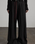 DOINDULGE Crinkled Wide Trousers with Red Thread