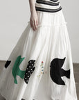 DOINDULGE Bird Patch Panel Maxi Skirt with Raw Volume Silhouette