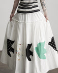 DOINDULGE Bird Patch Panel Maxi Skirt with Raw Volume Silhouette