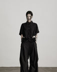 DOINDULGE Wide-Leg Draped Pants with Fringed Panels and Deconstructed Details