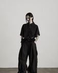 DOINDULGE Wide-Leg Draped Pants with Fringed Panels and Deconstructed Details