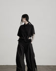 DOINDULGE Wide-Leg Draped Pants with Fringed Panels and Deconstructed Details