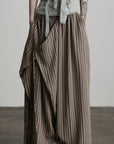 DOINDULGE Draped Asymmetric Wide-Leg Trousers in Textured Stripe