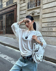 ROVENTE Draped Open Back Long Sleeve Top with Adjustable Strap
