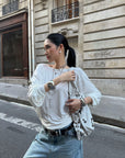 ROVENTE Draped Open Back Long Sleeve Top with Adjustable Strap
