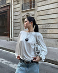 ROVENTE Draped Open Back Long Sleeve Top with Adjustable Strap