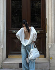 ROVENTE Draped Open Back Long Sleeve Top with Adjustable Strap