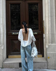 ROVENTE Draped Open Back Long Sleeve Top with Adjustable Strap