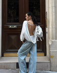 ROVENTE Draped Open Back Long Sleeve Top with Adjustable Strap