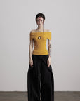 DOINDULGE Off-Shoulder Ribbed Knit Top with Wooden Medallion Detail