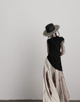 DOINDULGE Asymmetric Textured Sleeveless Top with Frayed and Beaded Detailing