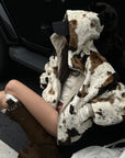 Veste réversible avec maille lisse et tissu pelucheux motif vache