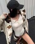 Veste réversible avec maille lisse et tissu pelucheux motif vache