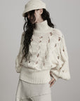 DOINDULGE Braided Void Turtleneck Sweater
