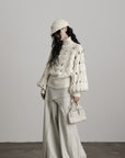 DOINDULGE Braided Void Turtleneck Sweater