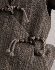 DOINDULGE Textured Wool Vest with Asymmetric Panels and Hand-Tied Toggle Details