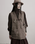 DOINDULGE Textured Wool Vest with Asymmetric Panels and Hand-Tied Toggle Details
