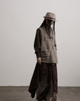 DOINDULGE Textured Wool Vest with Asymmetric Panels and Hand-Tied Toggle Details