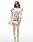 IAMXIAA T-shirt oversize blanc à épaules dénudées avec imprimé graphique