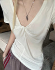 Rase le sol Twisted Deep V Asymmetric Hem Top