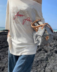 Rase le sol Amor Fati Off-Shoulder Oversized T-Shirt
