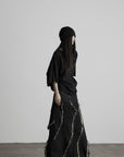 DOINDULGE Low-Rise Frayed Denim Maxi Skirt