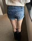 Rase le sol Distressed Denim Mini Shorts with Back Graphic Print and Raw Hem Detail