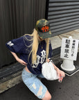 Rase le sol Low-Rise Asymmetric Waist Distressed Denim Pants