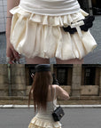 Rase le sol Cream Layered Ruffle Bubble Mini Skirt With Cross-Wing Appliqué