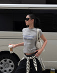 ROVENTE Vintage Grey Fitted Baby Tee with Statement Graphic