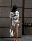 ROVENTE Layered Lace Bralette and Deep V Draped Graphic Tee Two-Piece Set