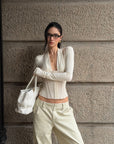 ROVENTE Draped Plunge Corset Long Sleeve Top