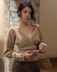 Hydrae Twist-Front Deep V-Neck Knit Top
