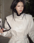 Hydrae Ivory High-Neck Belted Longline Trench Coat with Sculpted Raglan Seams