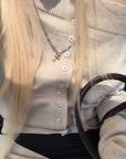 Rase le sol Wool Fallen Shoulder Button Knit Sweater
