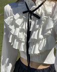 Rase le sol Ruffled High-Neck Ribbon Cropped Blouse