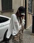 Rase le sol Amor Fati Cross-Embroidered Asymmetric Draped Long Sleeve Top