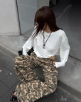 Rase le sol Amor Fati Cross-Embroidered Asymmetric Draped Long Sleeve Top