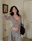 Hydrae Draped Wrap Front Ruched Long Sleeve Top With Asymmetric Neckline