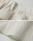 DOINDULGE Sculptural Ruffle Panel High-Waist Long Skirt
