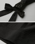 DOINDULGE Sculptural Ribbon Sleeve High Neck Shirt