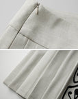 DOINDULGE Embroidered Panel Pleated Maxi Skirt