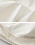 DOINDULGE Layered Cotton Skirt with Asymmetric Draped Hem
