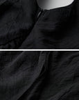 DOINDULGE Asymmetric Draped Maxi Dress with Textured Fabric and Wooden Bead Detail